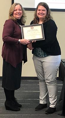 Becky Moore accepts NSLS certificate
